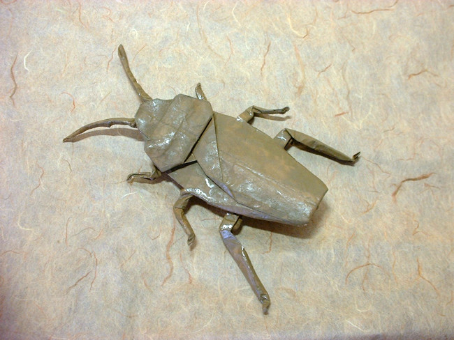 Origami Cockroach by Robert J. Lang. Folded from a painted square of thin brown wrapping paper by Gilad Aharoni on giladorigami.com