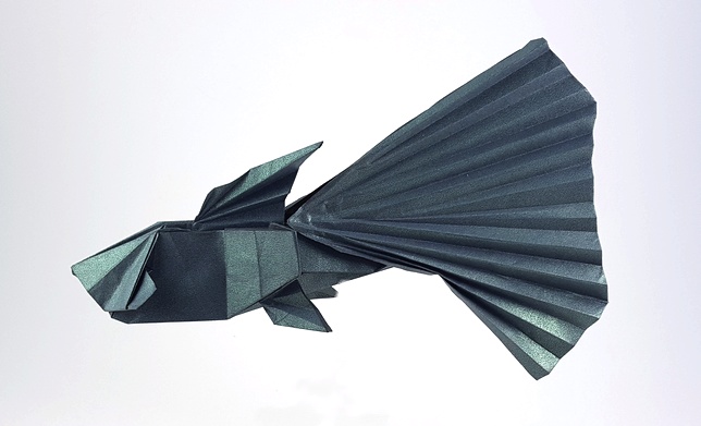 Origami Guppy by Meng Weining (212moving). Folded from a square of Shadow-Fold paper by Gilad Aharoni on giladorigami.com