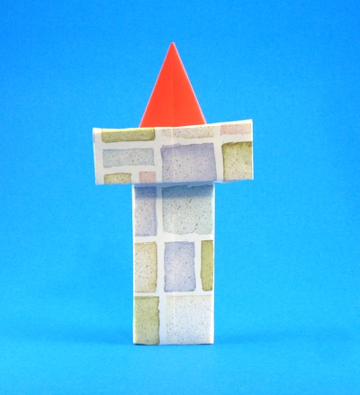 Origami Santa Claus in chimney by Yannick Gardin. Folded from a rectangle of scrapbooking paper by Gilad Aharoni on giladorigami.com