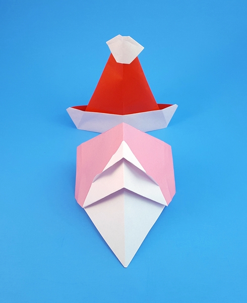 Origami Santa hat by Akira Yoshizawa. Folded by Gilad Aharoni on giladorigami.com