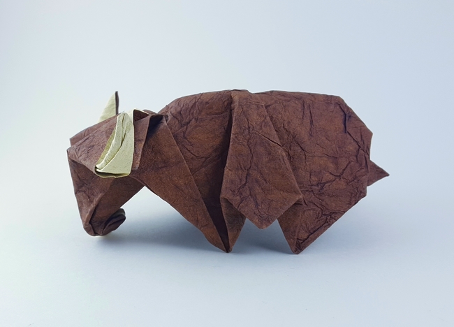 Origami Yak by Kunihiko Kasahara. Folded from a square of Tea Stained Leather scrapbooking paper by Gilad Aharoni on giladorigami.com